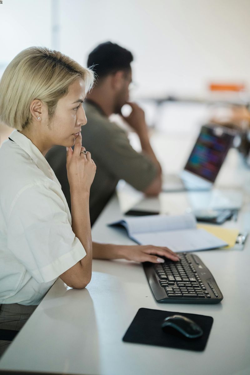 Services 3 woman looking in laptop and thinking